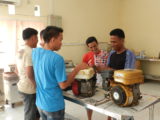 Group of man discussing next to some boat engines