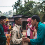 Group of people greeting each other